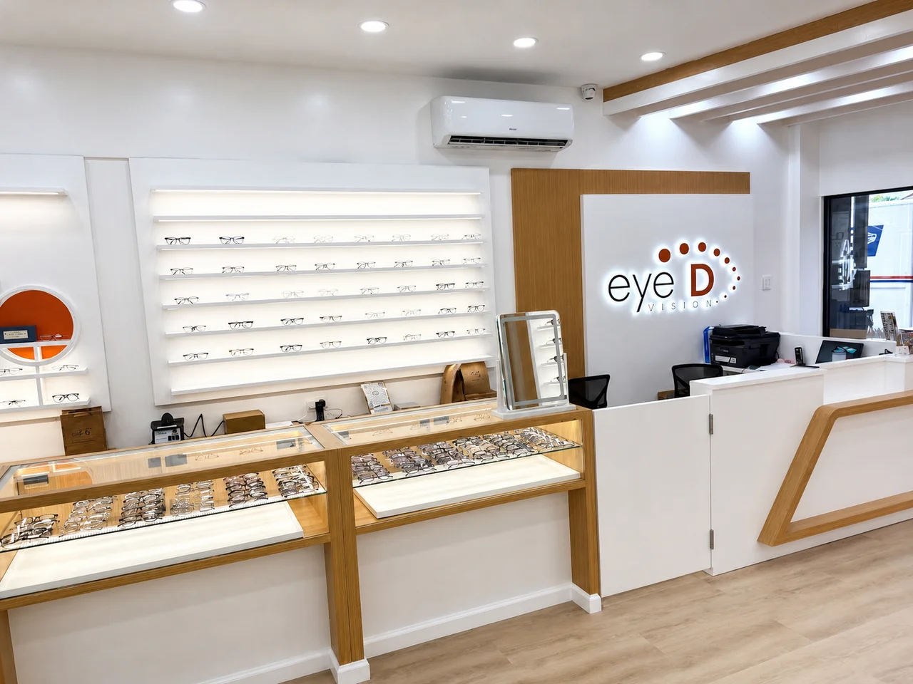 Reception desk and Eye D Vision sign inside the Bayside office